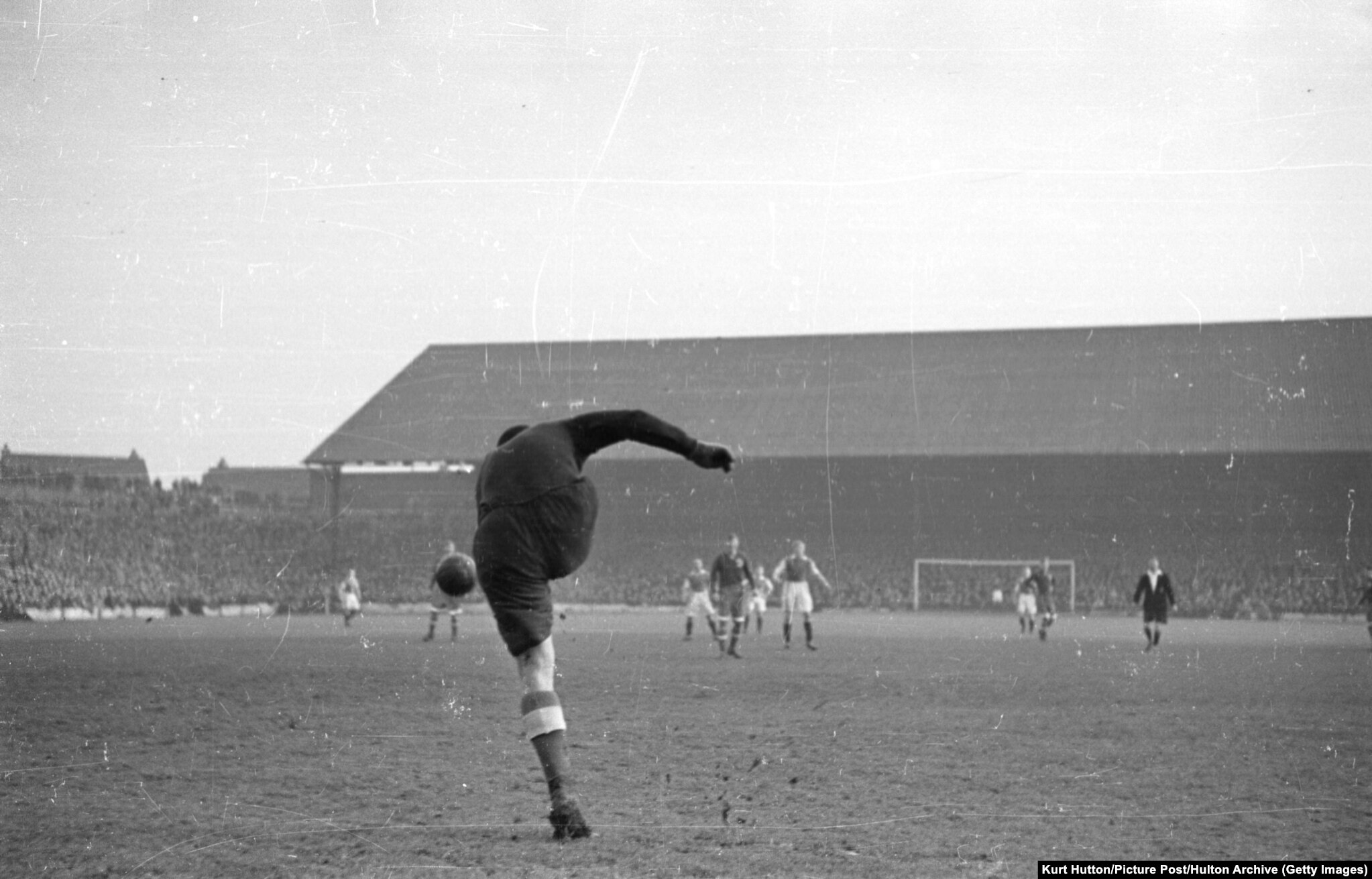 Dynamo Moscow goalkeeper Aleksei Khomich kicks the ball up-field at Cardiff City's Ninian Park ground during his team's British tour. Cardiff lost 10-1.