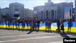 Під час акції в центрі Херсону проти російської окупації, 13 березня 2022 року