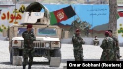 Afghan National Army soldiers keep watch at the site of a suicide attack in Kabul on April 29.