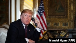 U.S. President Donald Trump speaks to members of the military from his Mar-a-Lago resort in Palm Beach, Florida, on November 22.