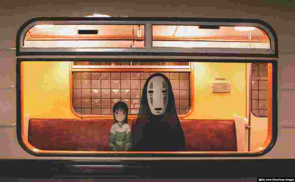 Chihiro and No-Face, from the Japanese anime fantasy film Spirited Away, ride the metro. 
