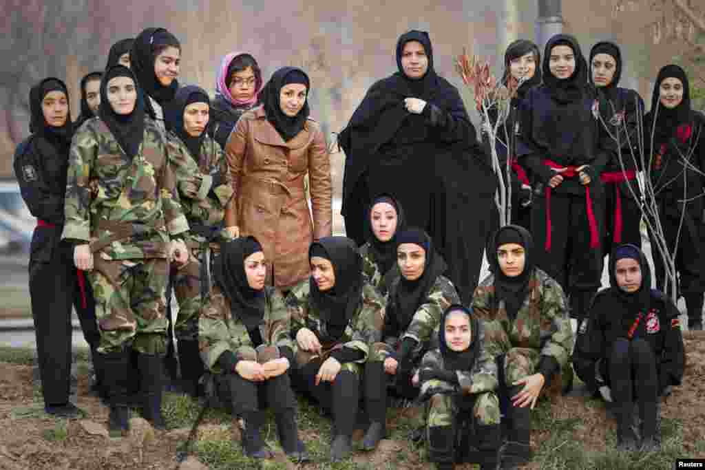 Parents, instructors, and students watch drills performed by fellow members of various Iranian ninjutsu schools.