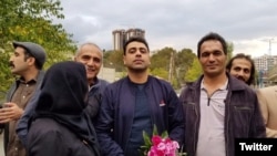 Esmail Bakhshi (C) with his family and friends after his release on bail. October 30, 2019.