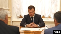 Medvedev has joined the leaders of Abkhaz and South Ossetia (foreground) in signing off on the cease-fire