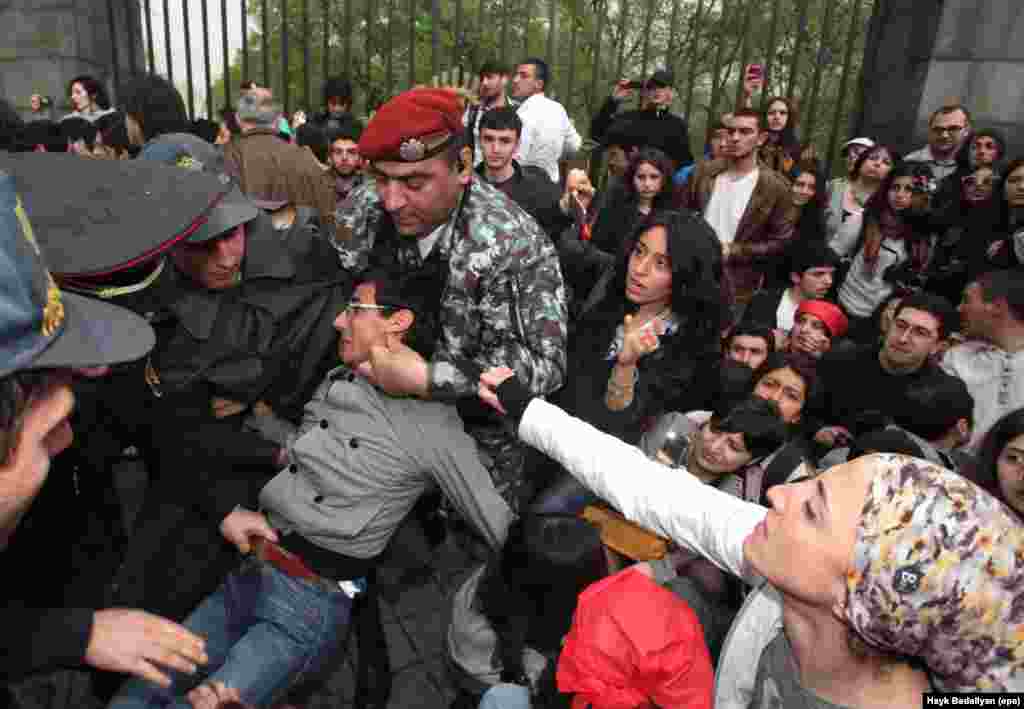 Armenian police detain a supporter of opposition leader Raffi Hovannisian during a protest in Yerevan following the inauguration of Armenian President Serzh Sarkisian for a second term on April 9.