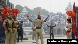 FILE:Indian Border Security Force personnel (brown) and Pakistani rangers (black) take part in the daily beating of the retreat ceremony at the India-Pakistan Wagah border crossing