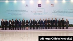 FILE: Energy ministers and officials from Central and West Asia, development partners, and ADB delegates pose at the CAREC Energy Ministers' Dialogue in Tashkent on September 20