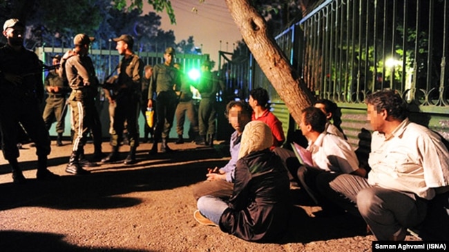 Several people arrested by Iranian police after participating in a party in Tehran, undated.