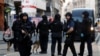 Police converge near the site of a deadly knife attack at London Bridge in the British capital on November 29.