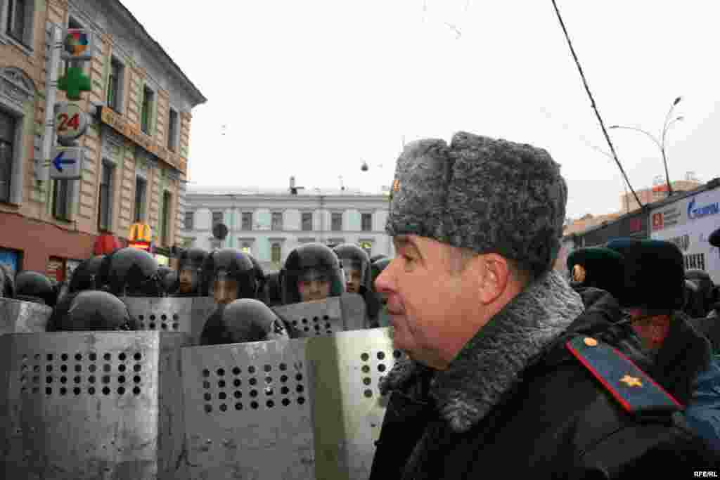 A commander girds his security forces, who are on hand to block marchers' path to the Central Election Commission building in Moscow on November 24 - Putin has said he will use Unified Russia to preserve influence, and a seemingly well-orchestrated campaign has emerged that professes millions of Russians' support for Putin to remain in power as "national leader"