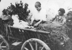 A wounded Polish fighter being transported from the front line.