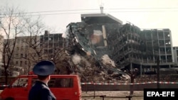 A member of the Russian delegation visiting Belgrade looks at the building of the Serbian Interior Ministry, which was totally destroyed in overnight NATO bombing, on April 3, 1999.