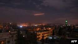 SYRIA -- A picture taken early on January 21, 2019 shows Syrian air defence batteries responding to what the Syrian state media said were Israeli missiles targeting Damascus. 