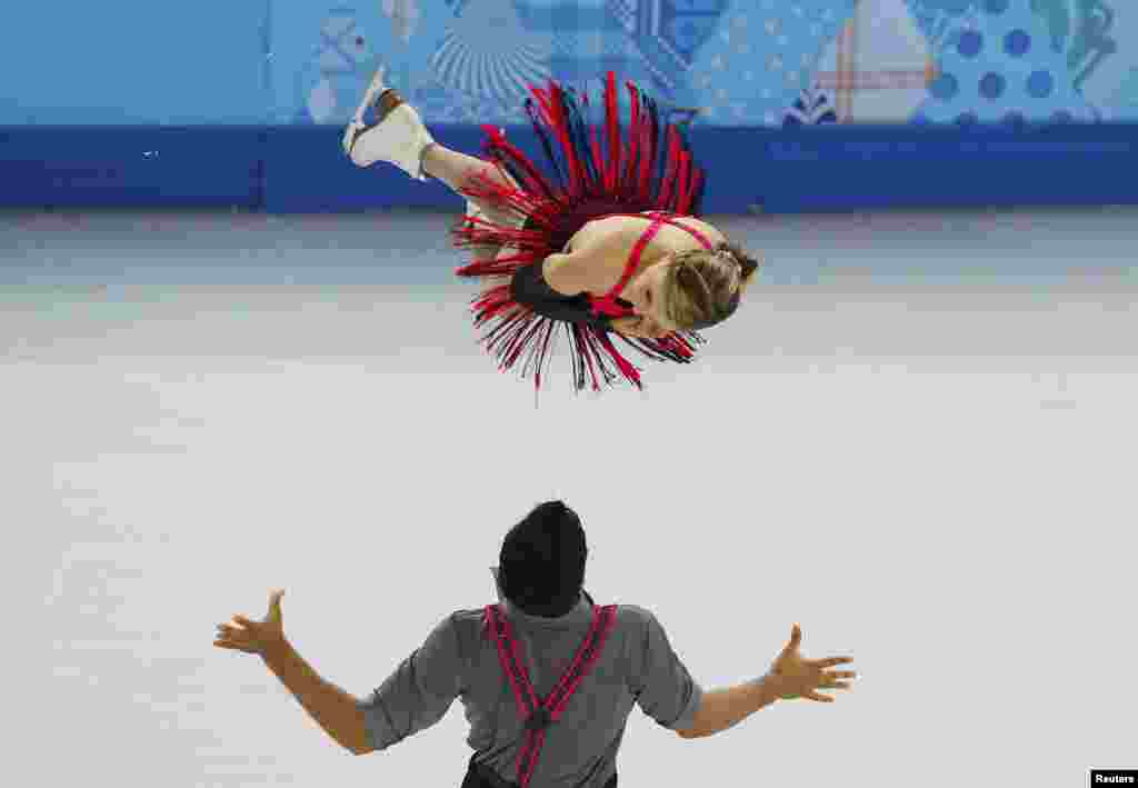 Canada's Paige Lawrence and Rudi Swiegers compete during the figure skating pairs short program.