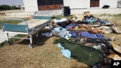 Libya -- Dead bodies lay outside the hospital in the Abu Salim district in Tripoli, 26Aug2011