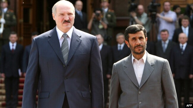 Belarusian President Alyaksandr Lukashenka(left) and his Iranian counterpart, Mahmud Ahmadinejad, walk during their meeting in Minsk in May 2007.