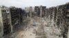 An aerial view shows residential buildings in the southern Ukrainian port city of Mariupol damaged by Russian attacks.