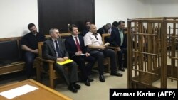 Members of the Russian diplomatic corps attending the trial in Baghdad of two Russian women sentenced to life in prison for Islamic State ties on April 17.