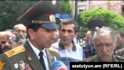 Retired Armenian Colonel Volodya Avetisian (left) and other war veterans at a demonstration in support of Nagorno-Karabakh war veterans in May last year. 