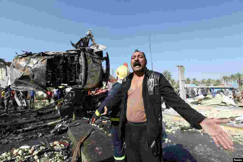 A man reacts at the site of a bomb attack in the city of Hilla, south of Baghdad, on March 6. (Reuters/Alaa al-Marjani)