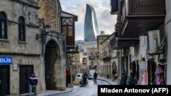 AZERBAIJAN -- A view of the Old town and the Flame Towers in Baku, March 18, 2019