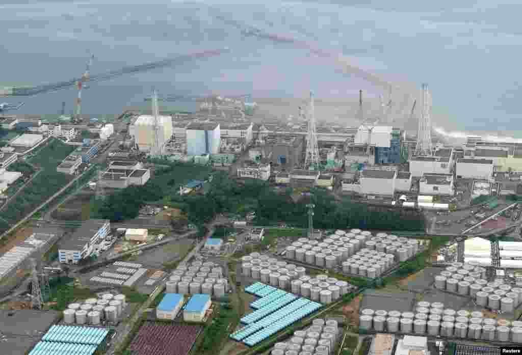 An aerial view of the Fukushima plant and its contaminated water storage tanks. In August, TEPCO said that 300 tons of water had leaked from one of the tanks.