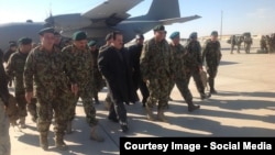 Abdul Jabbar Qahraman surrounded by senior officers of the Afghan army.