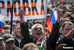 A man shouts during a pro-Russia rally near the regional government building in Donetsk in April 2014.