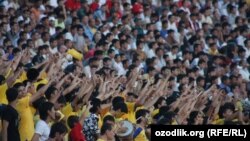 Uzbek soccer fans seen here in Tashkent in February (file photo)