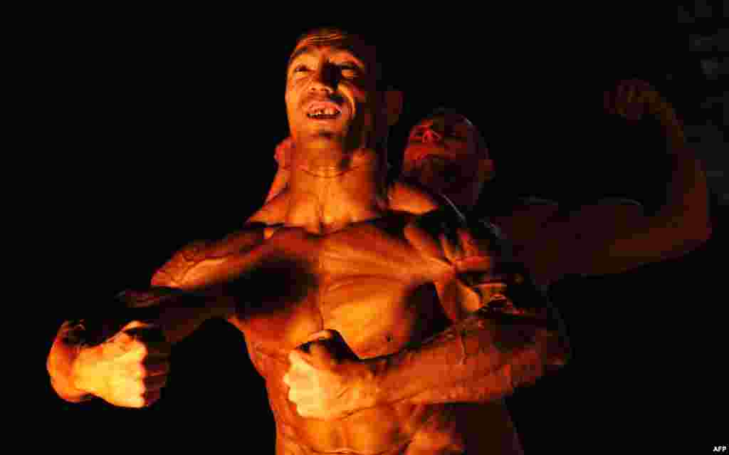 Participants compete in a men's classic bodybuilding contest in Bishkek, Kyrgyzstan. (AFP/Vyacheslav Oseledko)