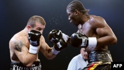 Georgian boxer Avtandil Khurtsidze (left) in a boxing match with a French opponent in 2010