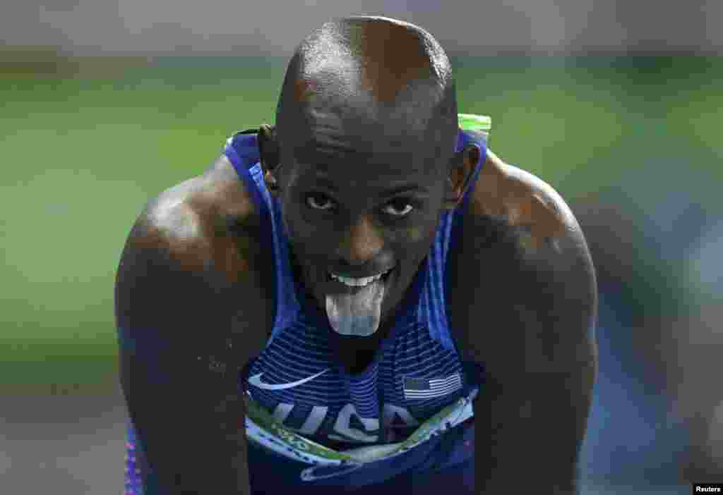 The United States&#39; Jeff Henderson celebrates winning the men&#39;s long-jump final during the athletics event at the Rio 2016 Olympic Games at the Olympic Stadium in Rio de Janeiro.