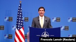 U.S. Secretary of Defense Mark Esper speaks at a news conference following a NATO defense ministers meeting at the alliance headquarters in Brussels on February 13.