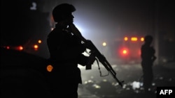 Afghan security forces at the site of a suicide attack in Kabul on October 18.