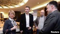 EU Deputy Secretary General for the External Action Service Helga Schmid with Ukrainian opposition leaders Vitali Klitschko, Arseniy Yatsenyuk, and Oleh Tyahnybok (left to right) at a meeting in Kyiv on January 30.