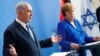 Israeli Prime Minister Benjamin Netanyahu (left) gestures during a news conference with German Chancellor Angela Merkel in Berlin on June 4.