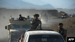 Afghan security forces patrol following an operation against Islamic State (IS) militants in Pachir Wa Agam district of Nangarhar province on December 3.