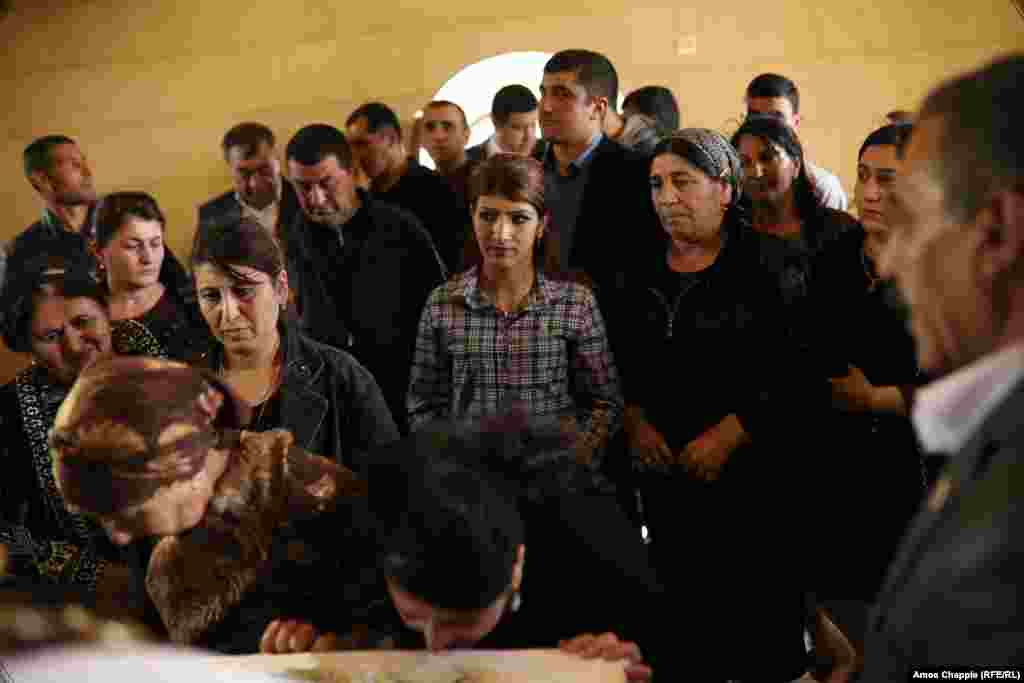 Armenian Yazidi women pay their respects to the Peacock Angel inside a temple in Aknalich, near Yerevan. For Yazidis, Melek Taus is above the concepts of good and evil -- comparable to fire, which can cook and warm but also burn and destroy.