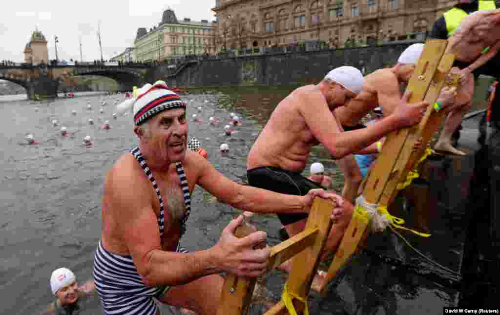 Bathers participate in the annual Christmas winter-swimming competition on the Vltava River in Prague on December 26. (Reuters/David W. Cerny)