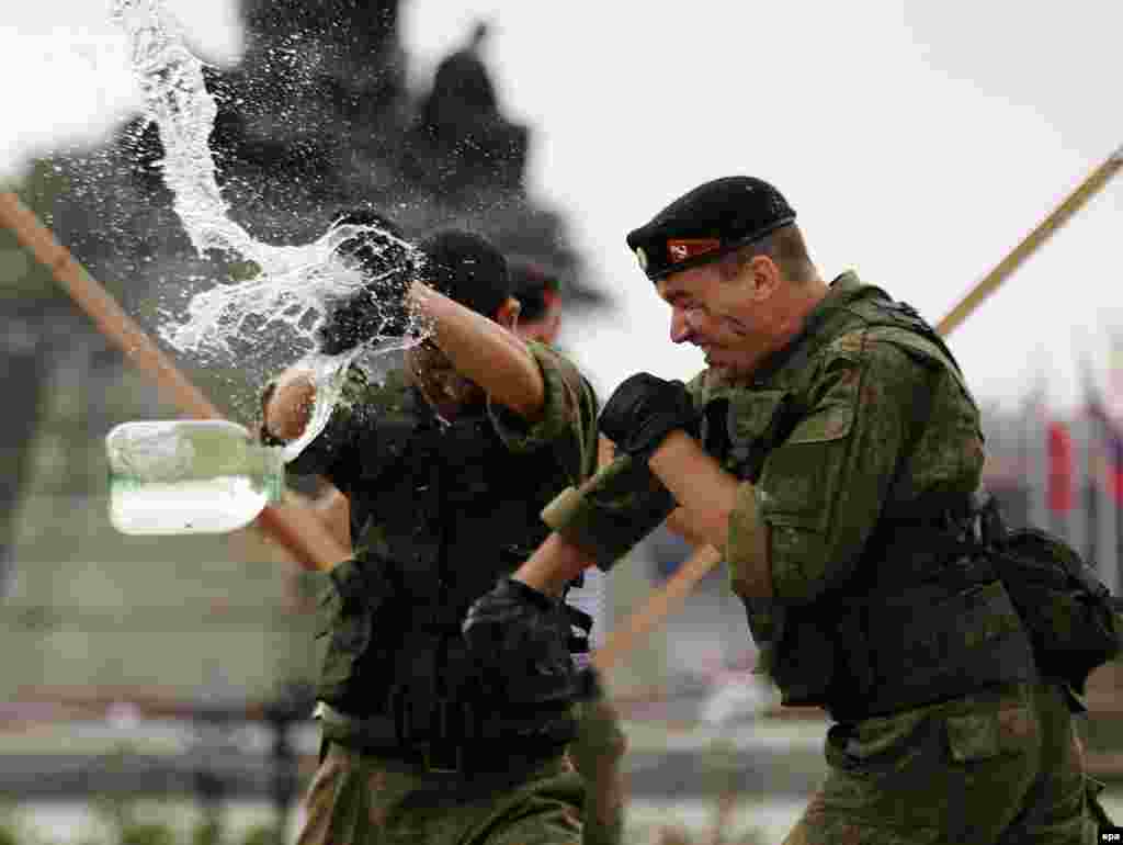 Russian marines attached to the antisubmarine ship Admiral Tributs show their skills during a demonstration at a park in Manila, Philippines. (epa/Francis R. Malasig)