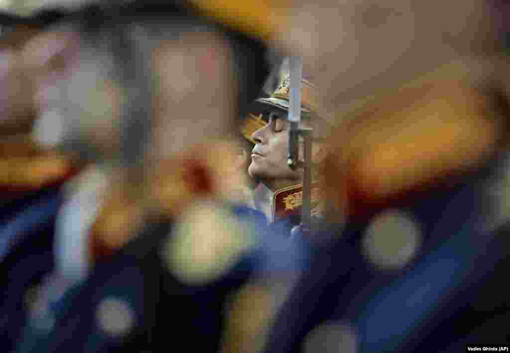 An honor guard soldier closes his eyes while standing at attention in Bucharest, Romania, during a memorial ceremony for the victims of the 1989 uprising. The anticommunist uprising, which left more than 1,000 people dead and ended the rule of dictator Nicolae Ceausescu, started in the western Romanian town of Timisoara on December 16, 1989, and in Bucharest on December 21, 1989. (AP/Vadim Ghirda)