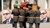 FILE: Afghan army officers carry the coffin of former President Sardar Muhammad Daud Khan in March 2009.