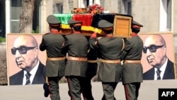 FILE: Afghan army officers carry the coffin of former President Sardar Muhammad Daud Khan in March 2009.