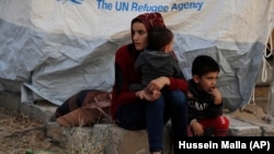 Сирийские беженцы в лагере для перемещенных лиц в Турции