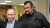 Russian President Vladimir Putin (left) with American movie actor Steven Seagal, who has just been named as a "special representative" for Russian-U.S. cultural links. (file photo)