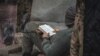 Боєць полку &laquo;Дніпро-1&raquo; читає біблію на своєму блокпості