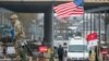 A U.S. flag blows over a tank in front of an Estonian-Russian border point during a military parade to celebrate 97 years since first achieving independence in 1918 in Narva in February.