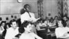 A black student, Nathaniel Steward, 17, recites his lesson on May 21, 1954, at the Saint-Dominique school in Washington, D.C. The school was among the first to hold integrated classes of black and white students following Brown v. Board of Education, the Supreme Court decision outlawing school segregation.