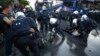 Dozens Of Police, Demonstrators Injured In Protests Ahead Of G20 Summit