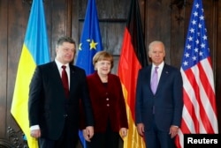 Ukrainian President Petro Poroshenko (left), German Chancellor Angela Merkel, and U.S. Vice President Joe Biden at the 51st Munich Security Conference on February 7.